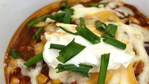 Turkey Chili with cheese, sour cream and green onions